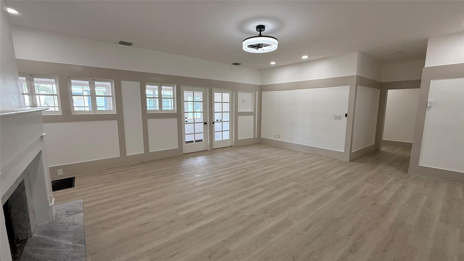 Beautiful great room... doors to rear sunroom.