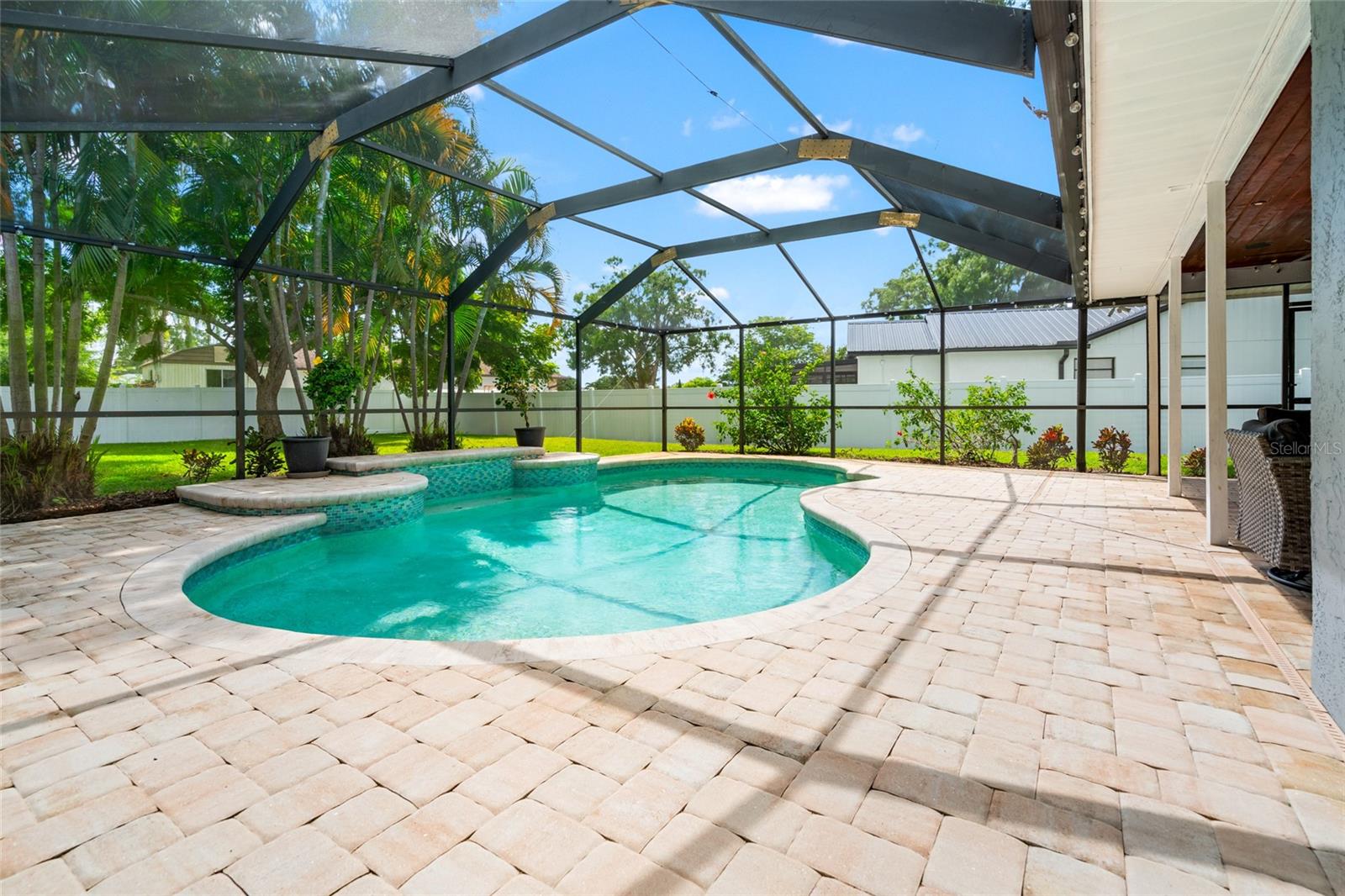 Pool looking out at yard showing fence
