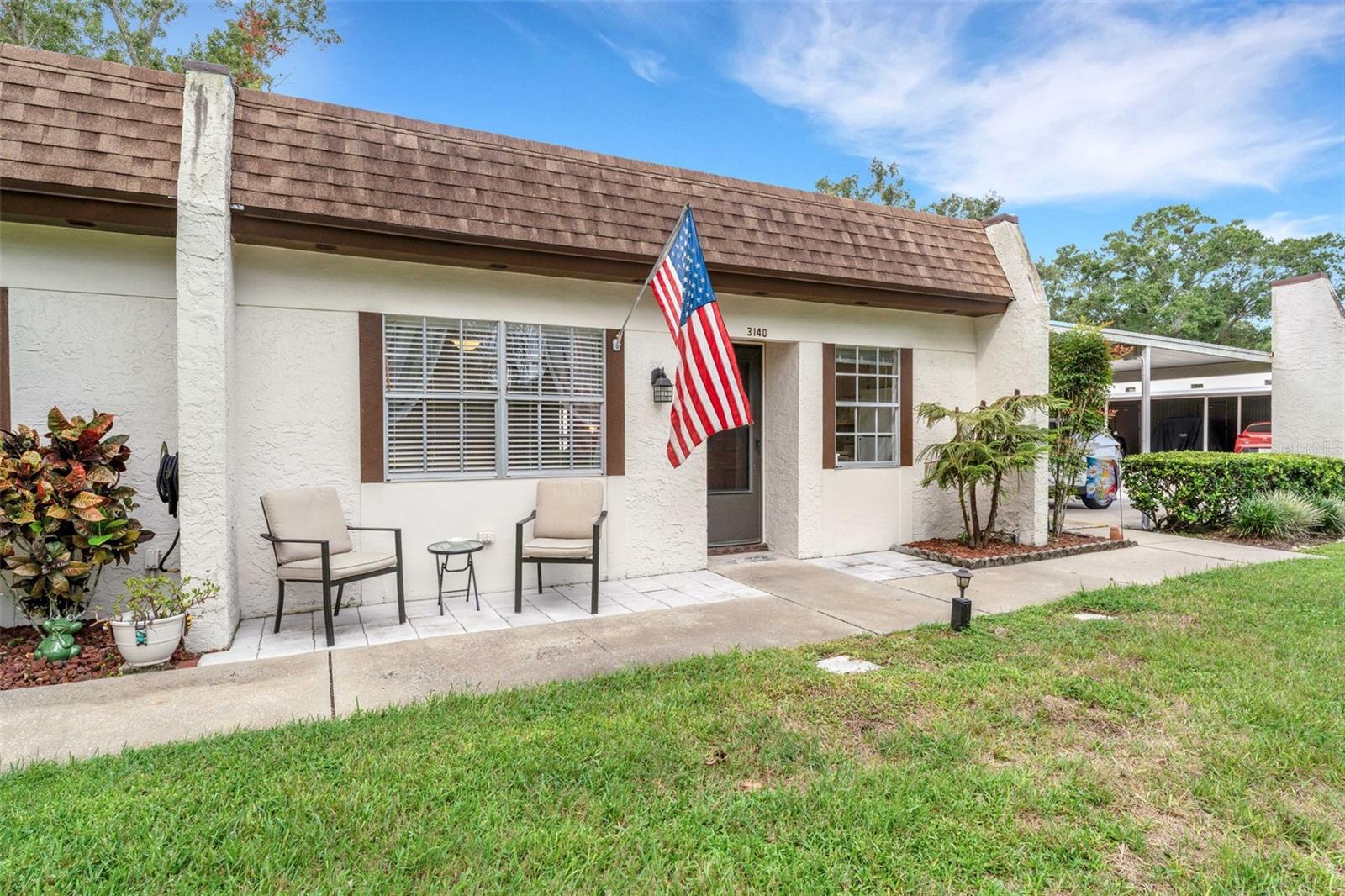 Welcome to this End Unit, around the corner from your Carport