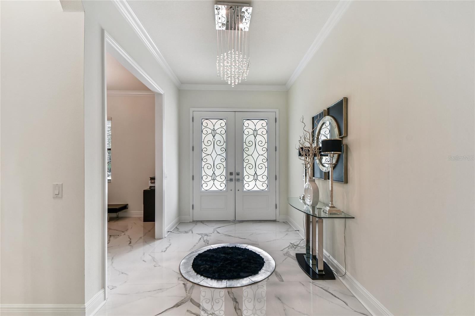 Foyer open to home office to left