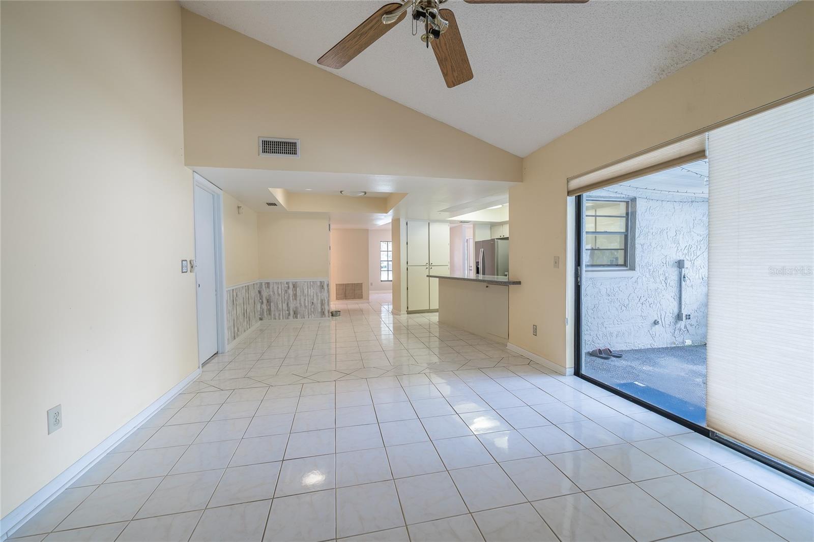 family room and sliders leading to porch