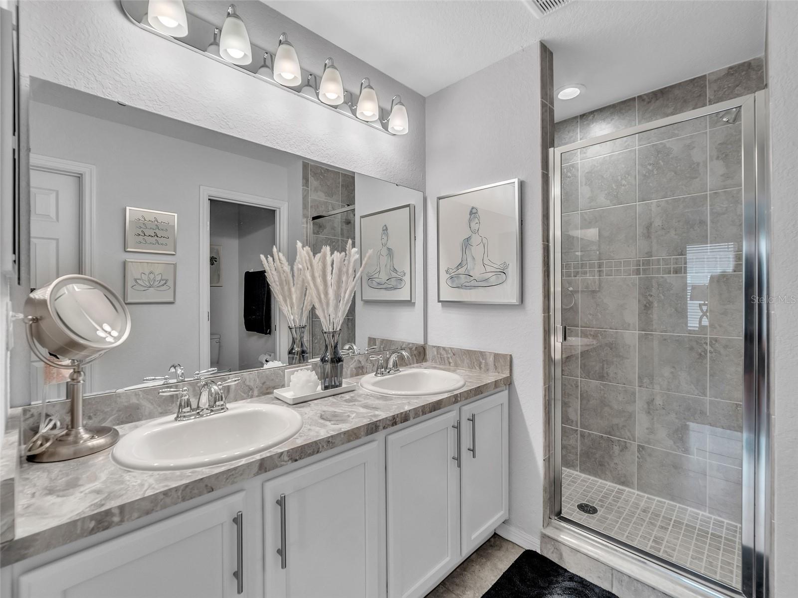 Primary En-Suite with Dual Vanities and Walk In Closet
