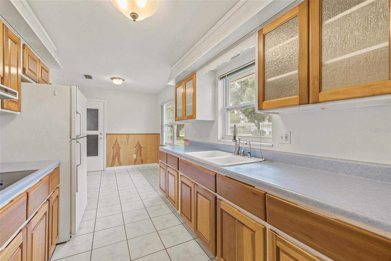 Kitchen Dinette Area Door Leads to the Garage