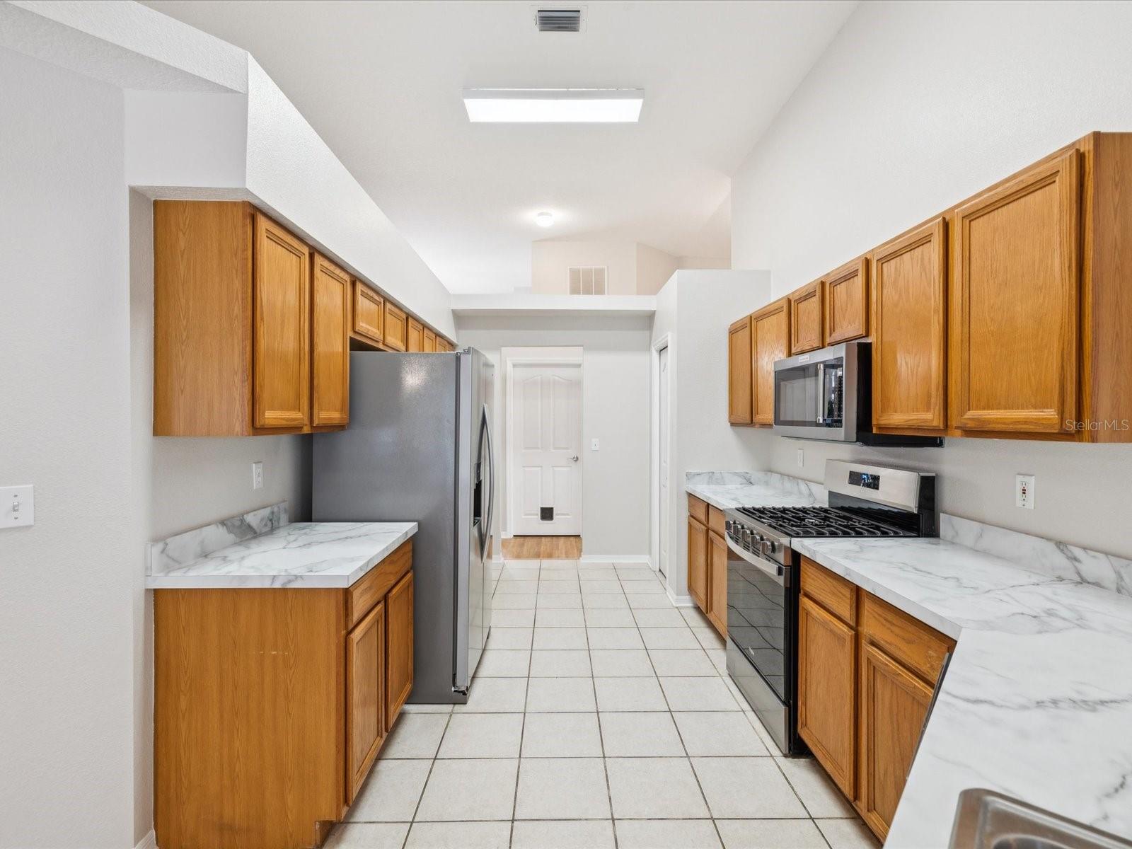 Plenty of countertops and cabinets make excellent tools for storage and prep work.