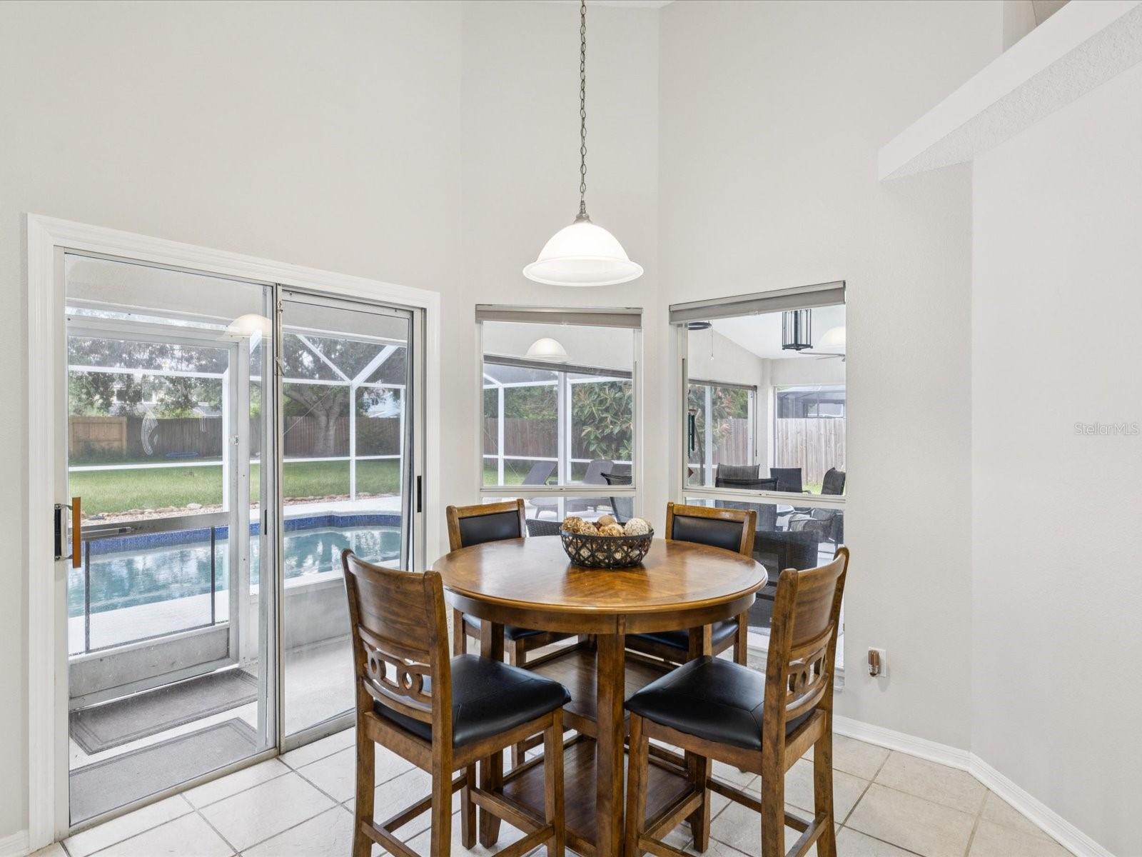 The kitchen nook is perfect for poolside views and intimate meals.