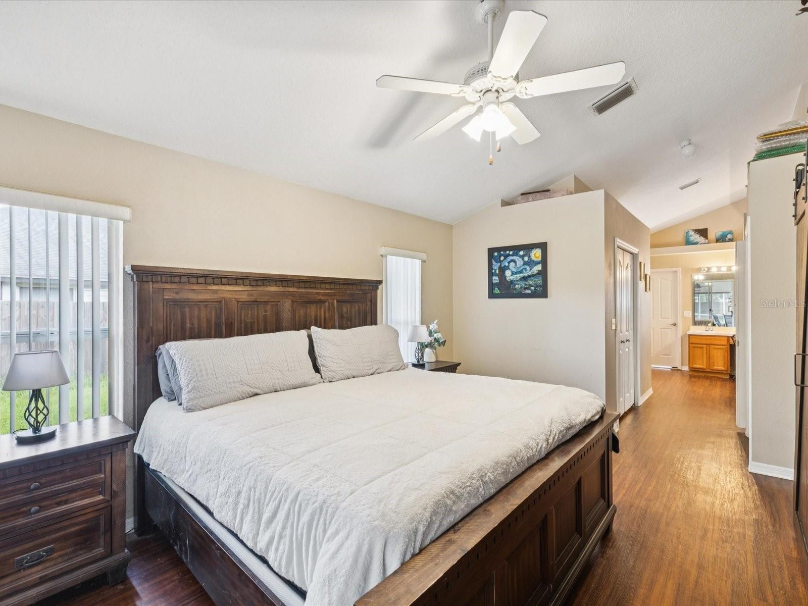 Double doors lead to the spacious primary suite. Outfitted with two closets and a seamless entry into the primary bathroom.