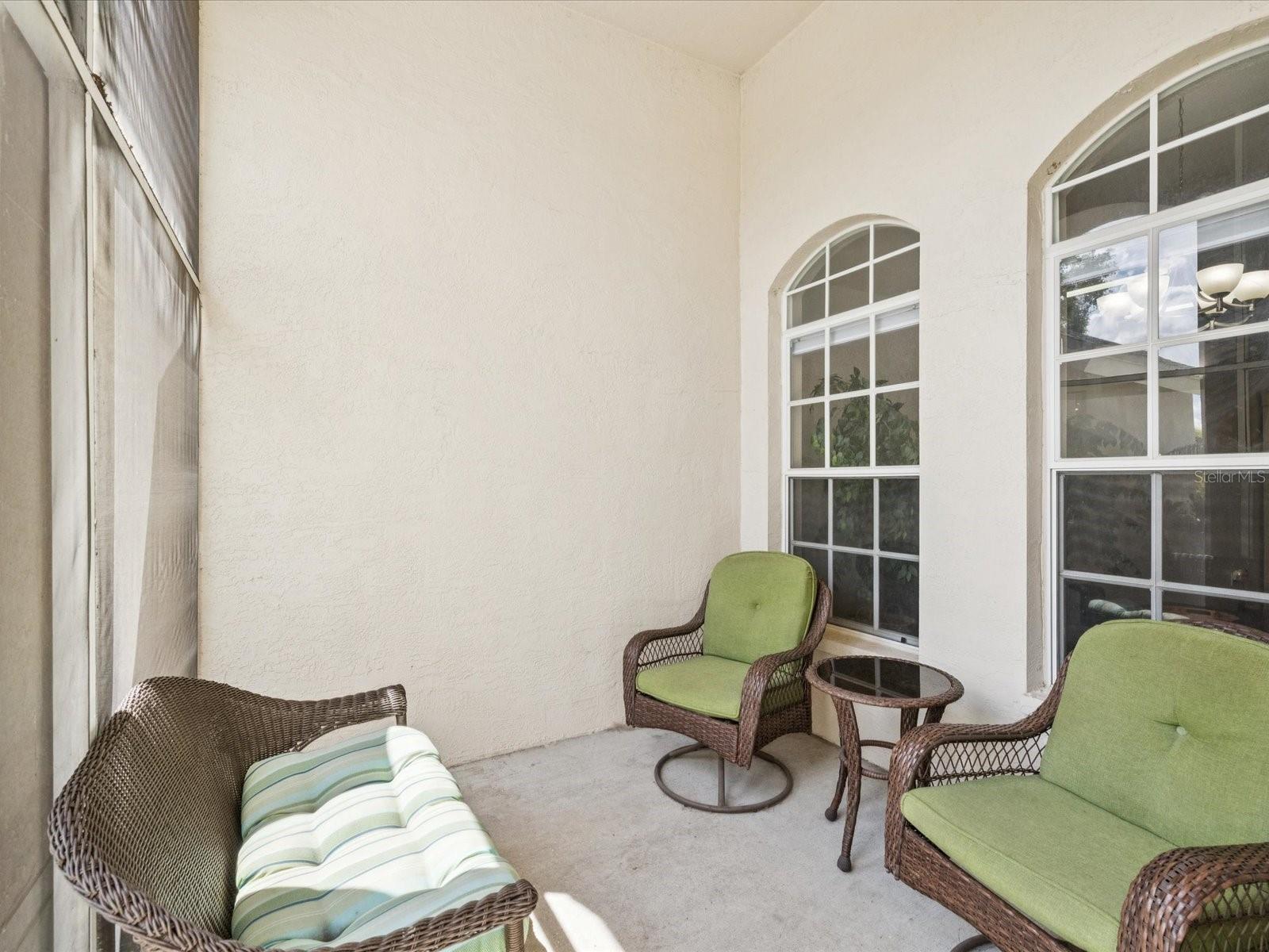 The fully enclosed screened in front porch lets you enjoy many quiet moments bug free.