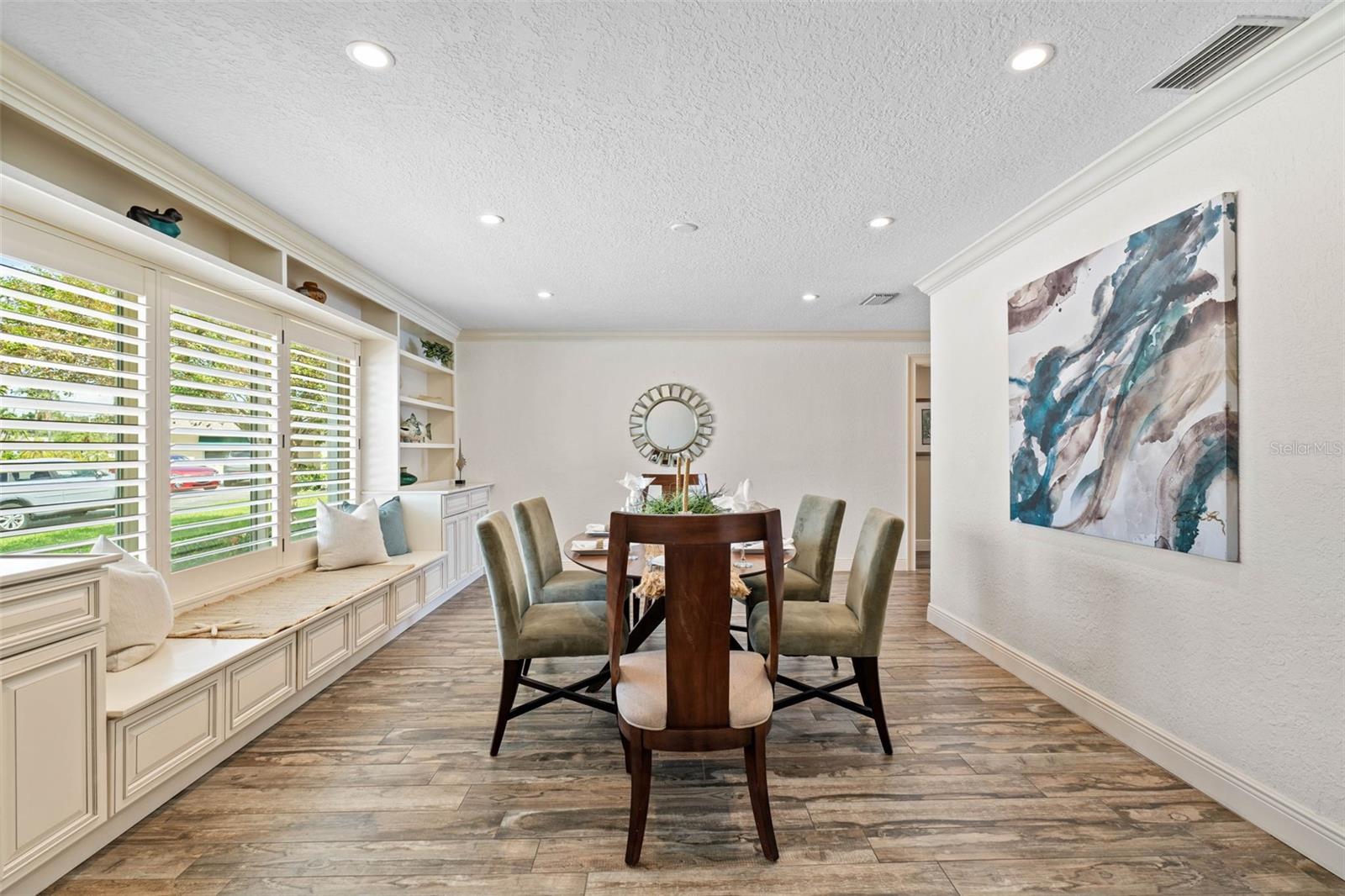 Dining Area with Beautiful Built-in Cabinets and Shelves