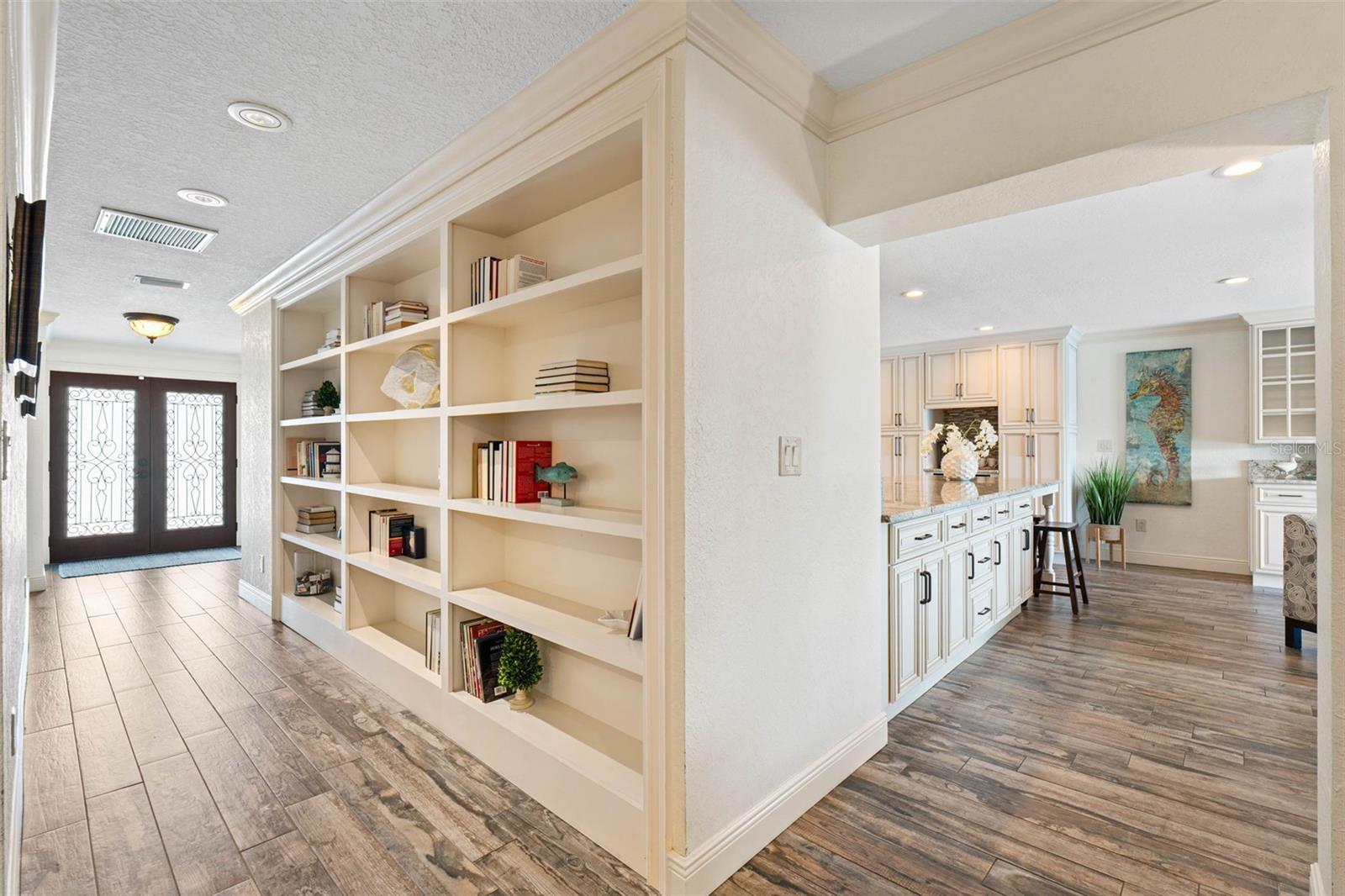 Expansive foyer with Custom Bookcase