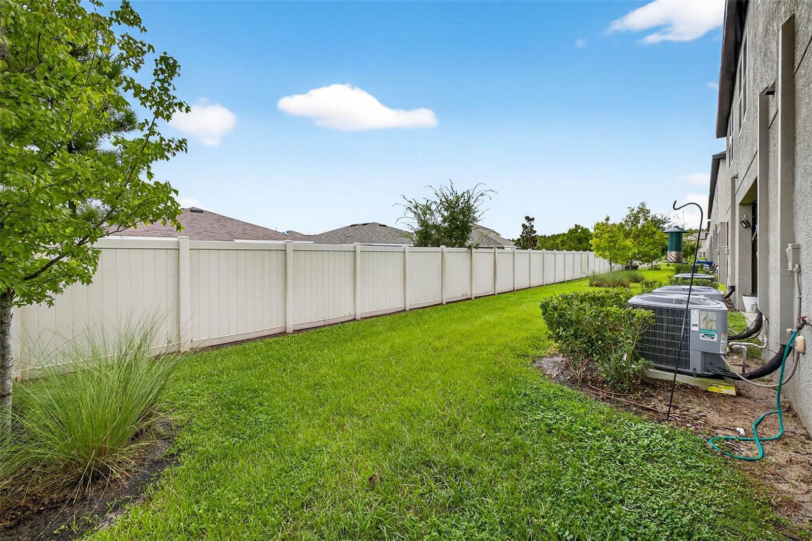 Backyard is partially fenced with privacy fencing.