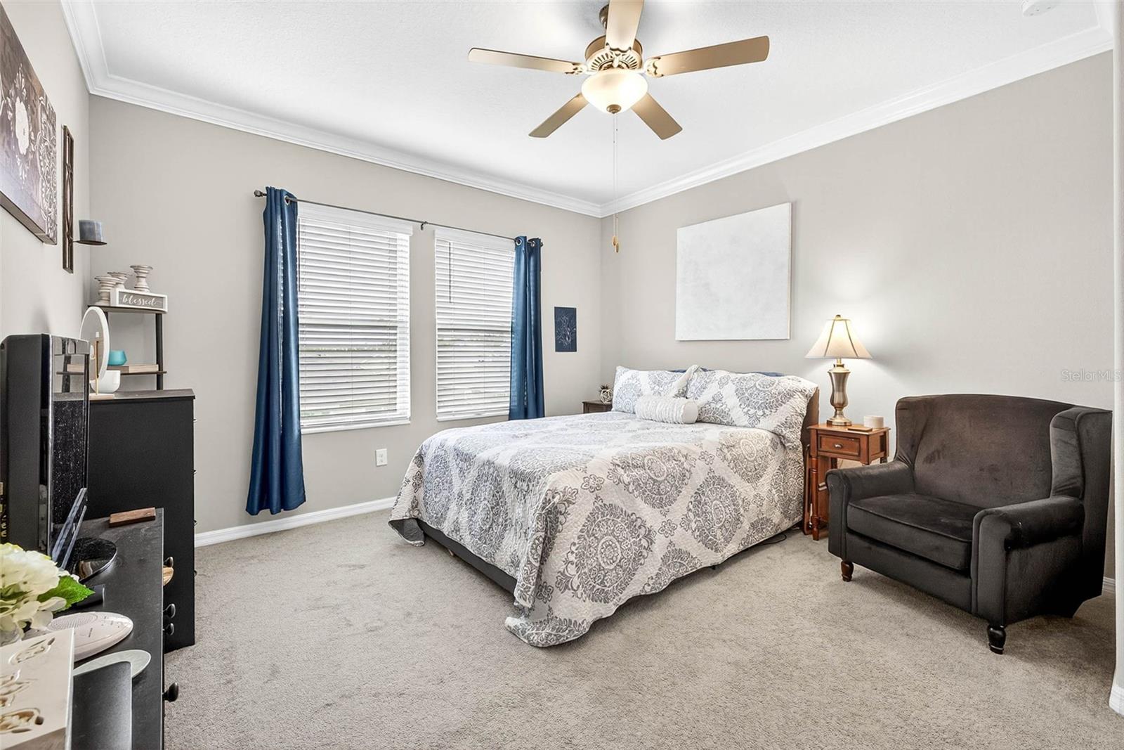 Large primary suite crowned, high ceilings.