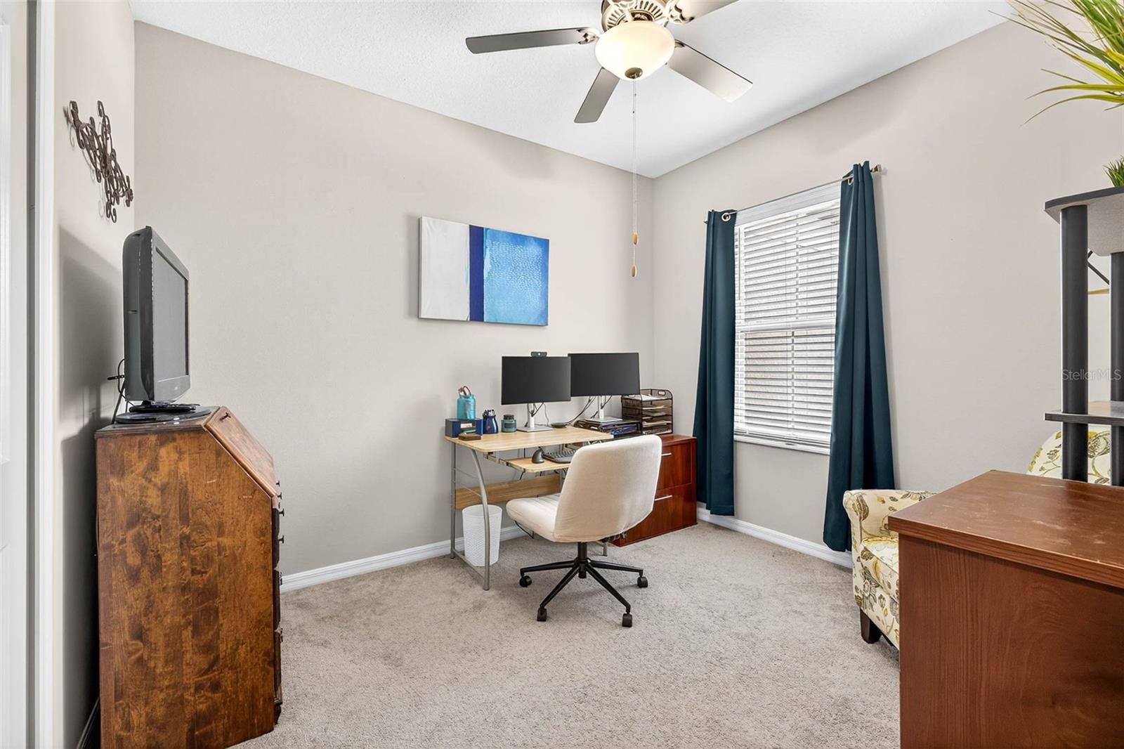 Bedroom 2 currently utilized as work from home office.