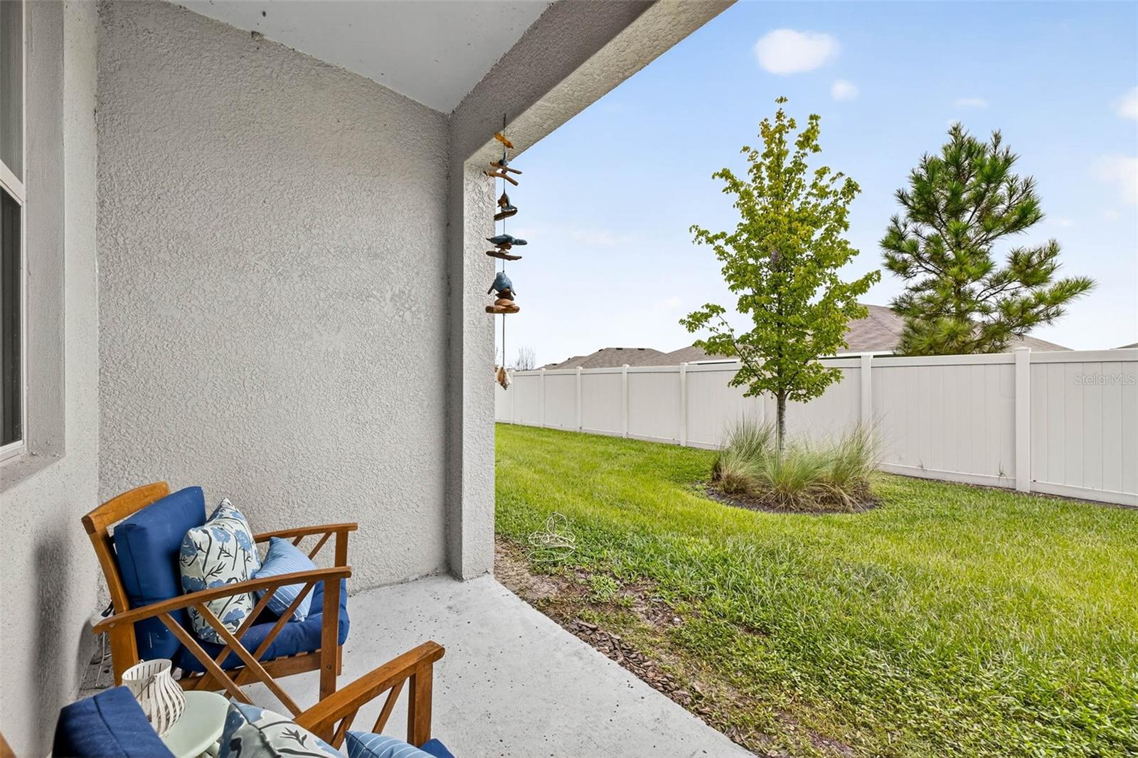 Back yard with seating area on the lanai.