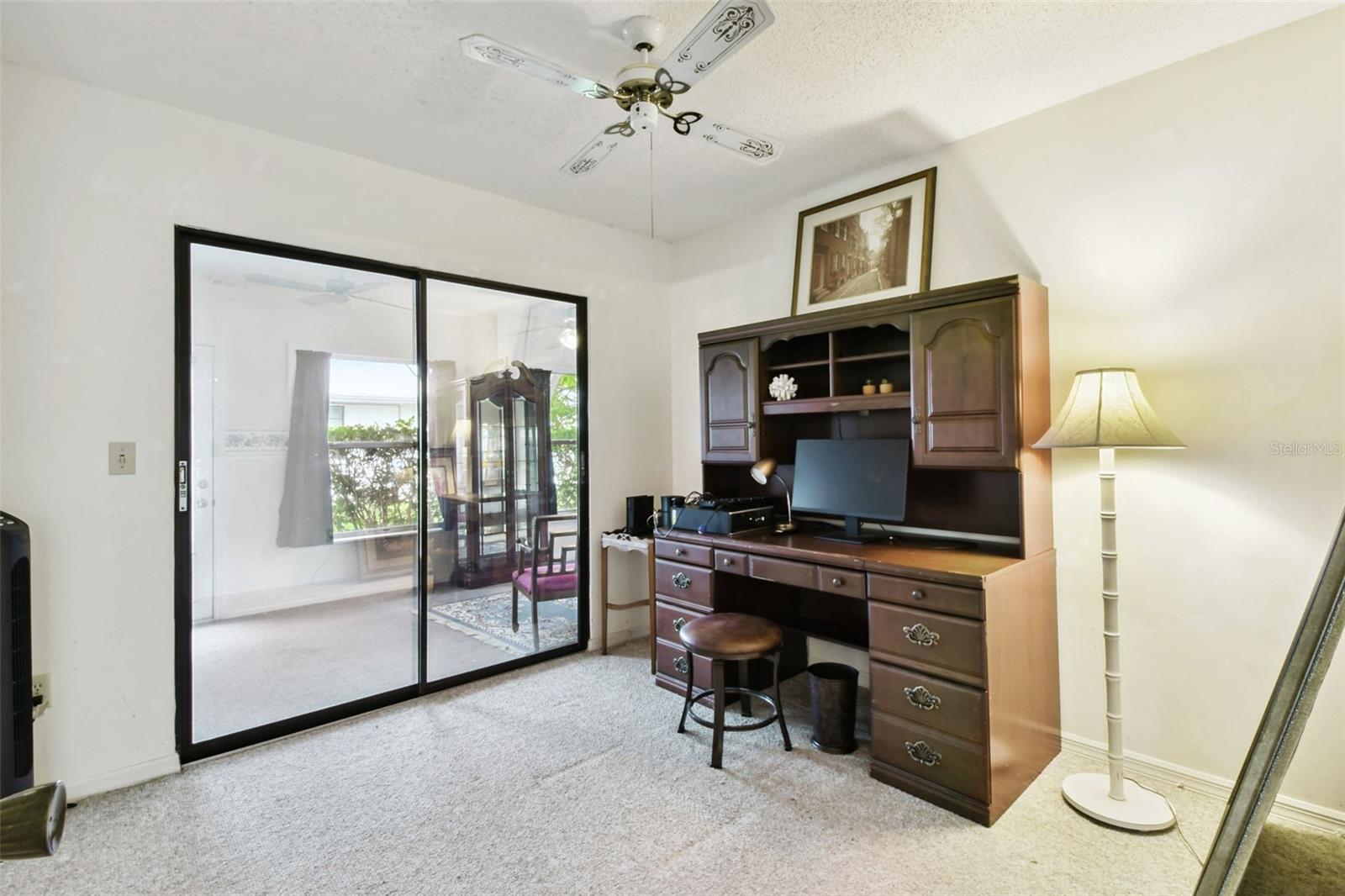 office with sliders to the florida room