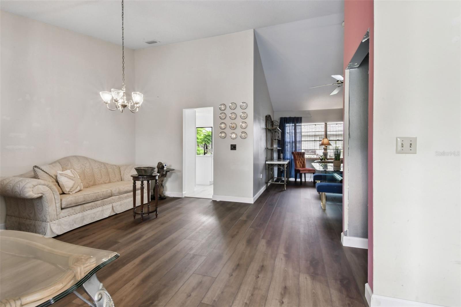 living room or could be the formal dining room all newer vinyl plank flooring! Don't you just love the vaulted ceilings!