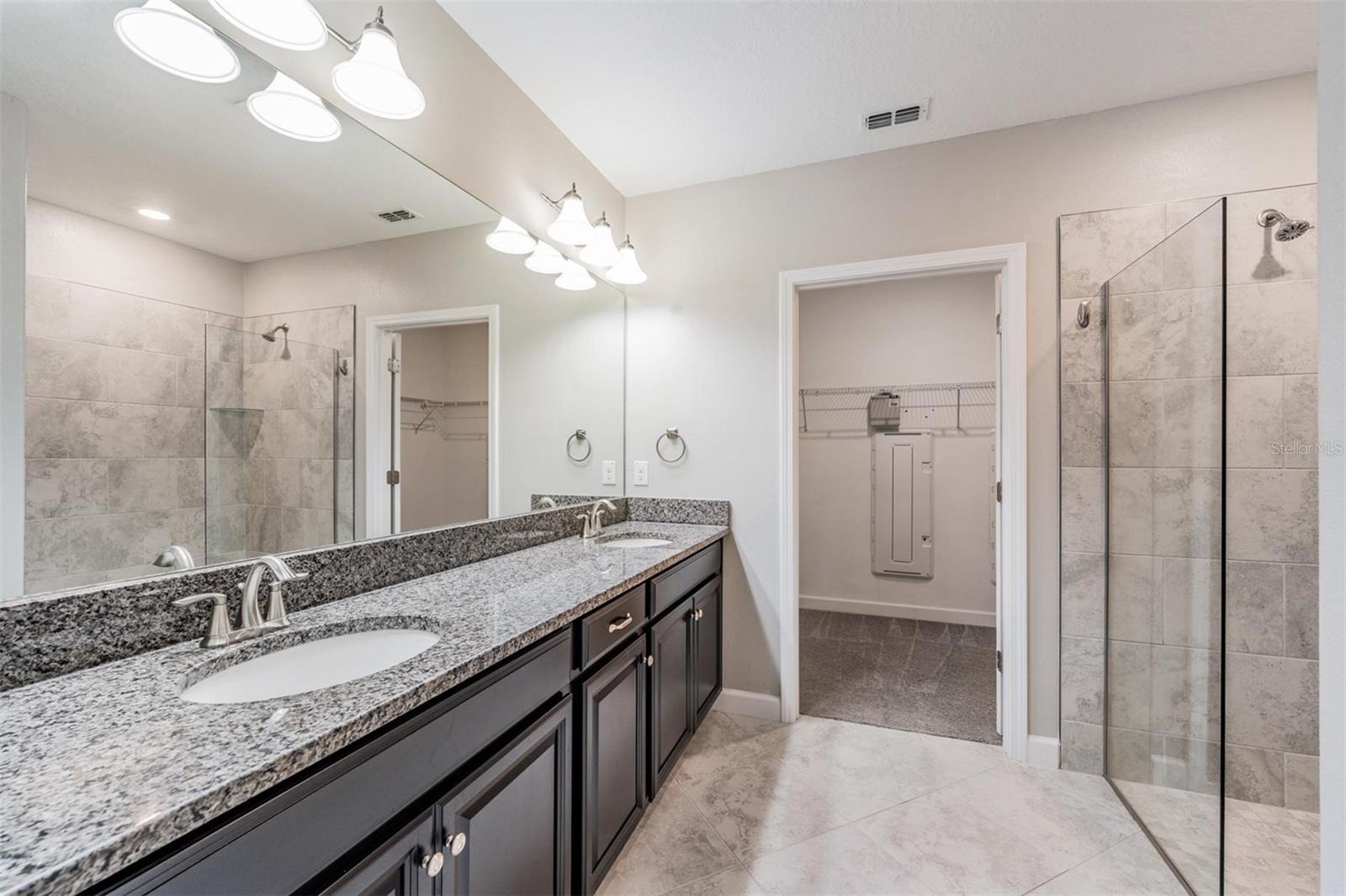 Spacious counter & double sinks in owners bath