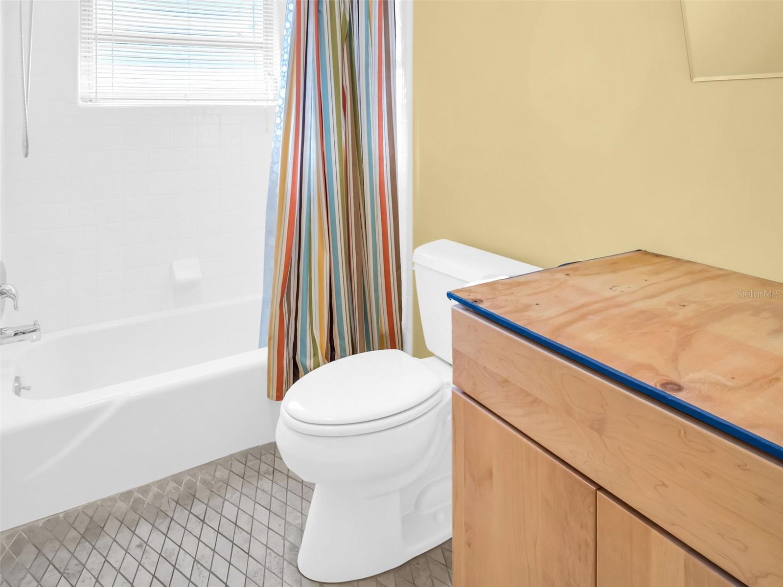 Upstairs Bathroom, pocket door separates tub and toilet area