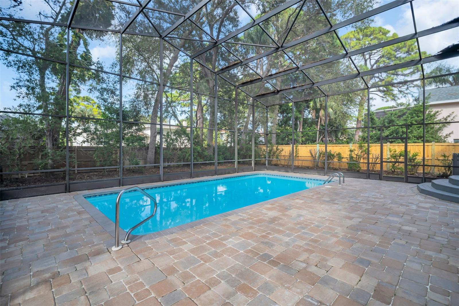 Pool with freshly sanded and sealed pavers