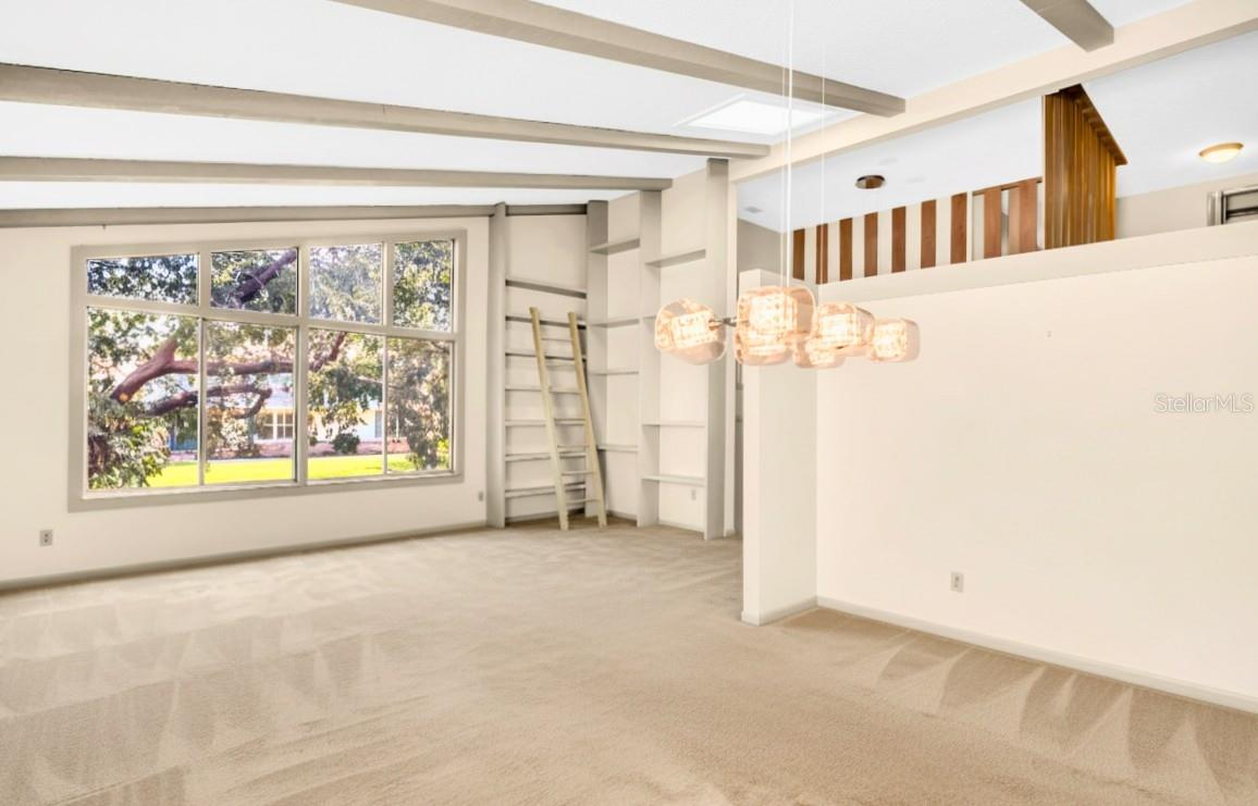 Dining Room/Living Room with Bookshelves