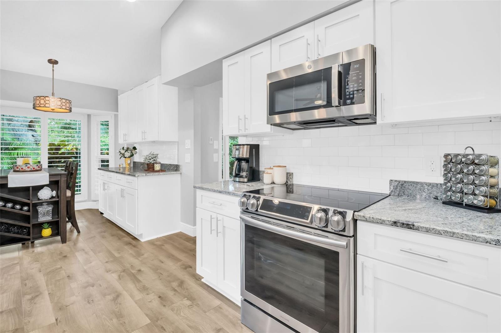 Remodel included expanding cabinet & counter space without sacrificing casual dining in the breakfast nook~