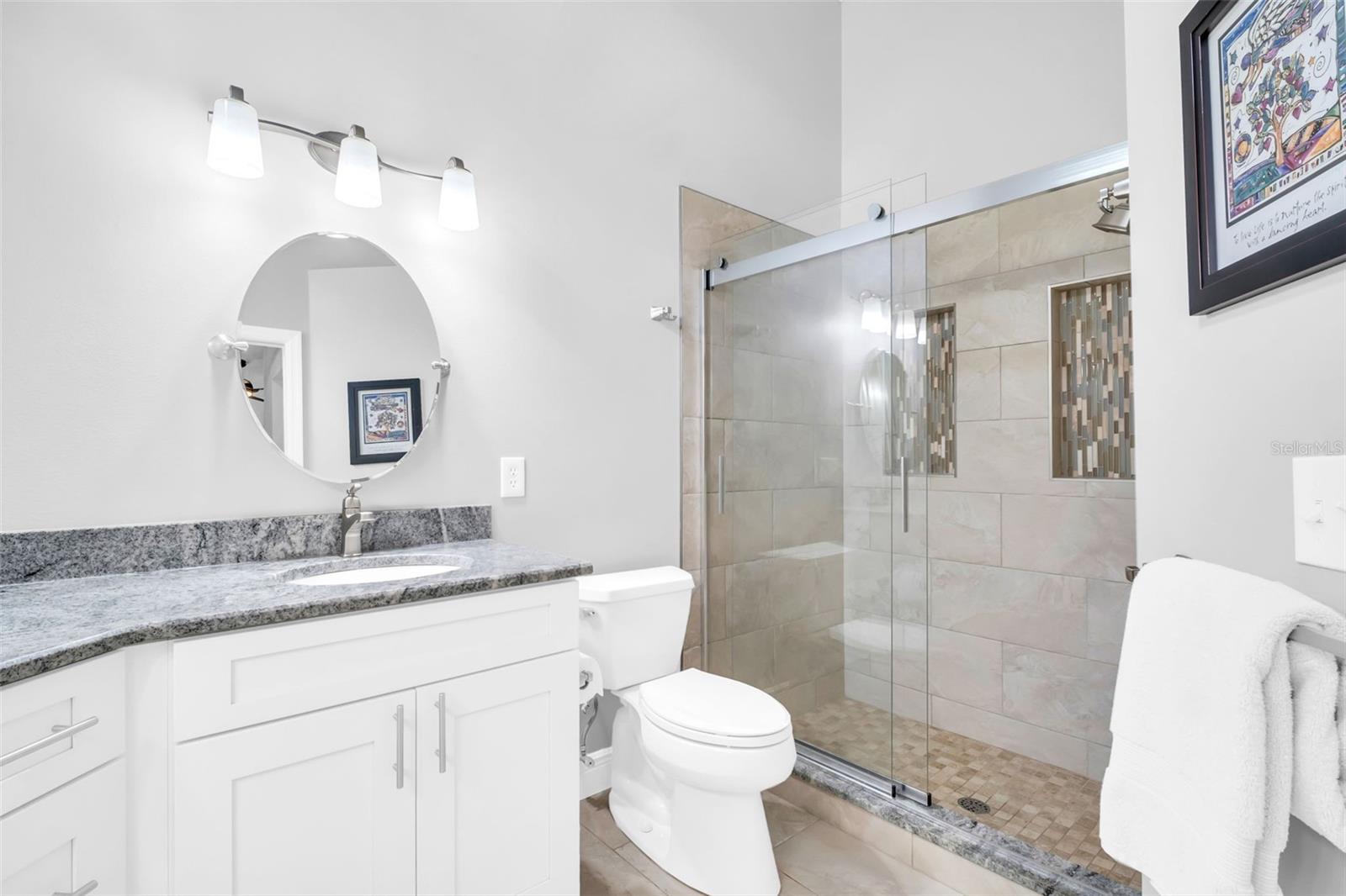 Fully renovated master en-suite with walk-in shower, dual vanities, updated lighting & fixtures~