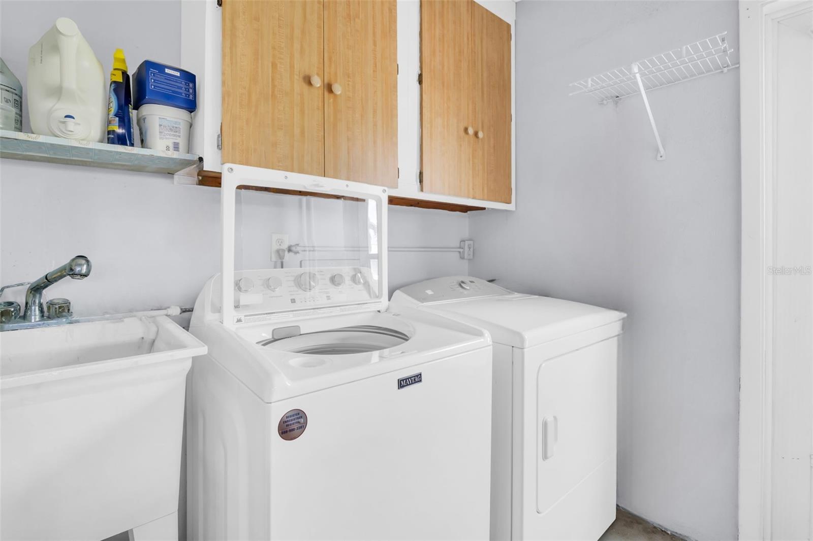 Laundry with a utility sink nicely located the garage~