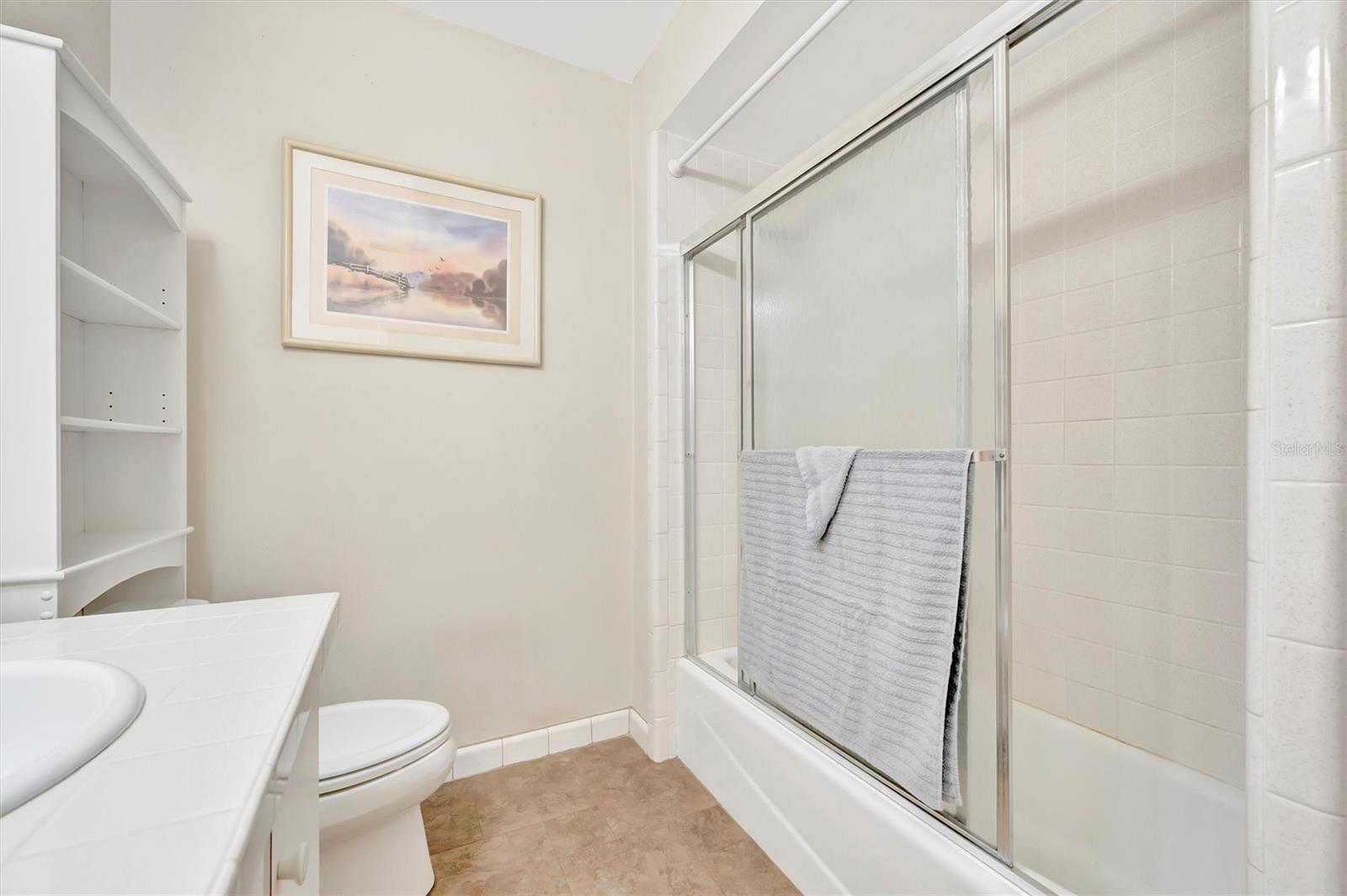 Full bathroom featuring a bathtub in a clean, functional layout