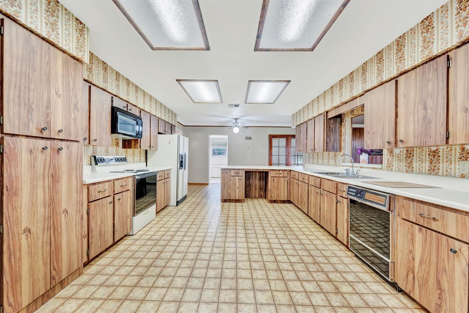 Generous kitchen layout with great potential for modern upgrades.Spacious kitchen