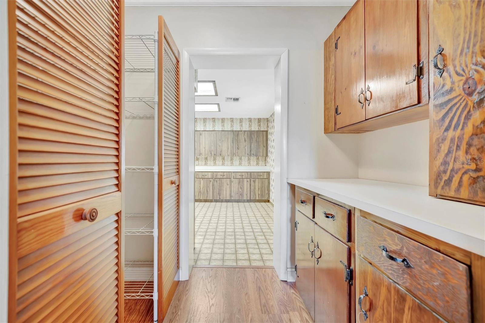 Butler’s bar  flows into the walk-in pantry