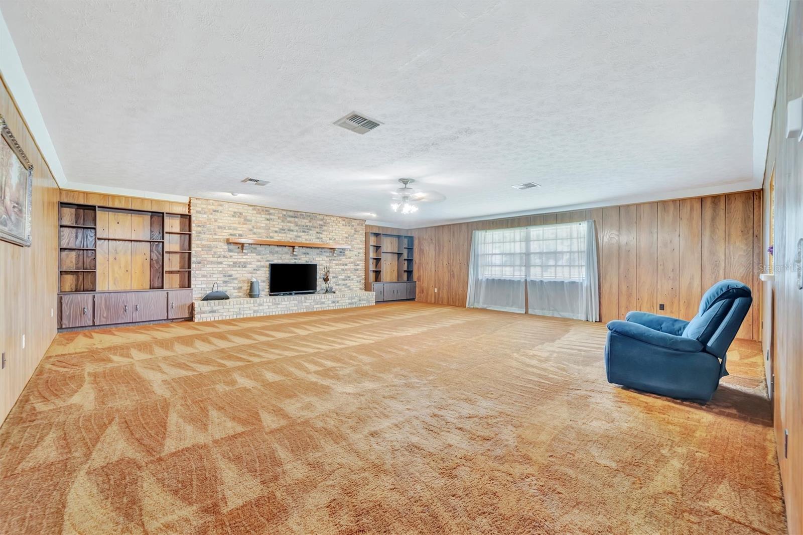 Family Room-Large windows fill the room with bright, natural light