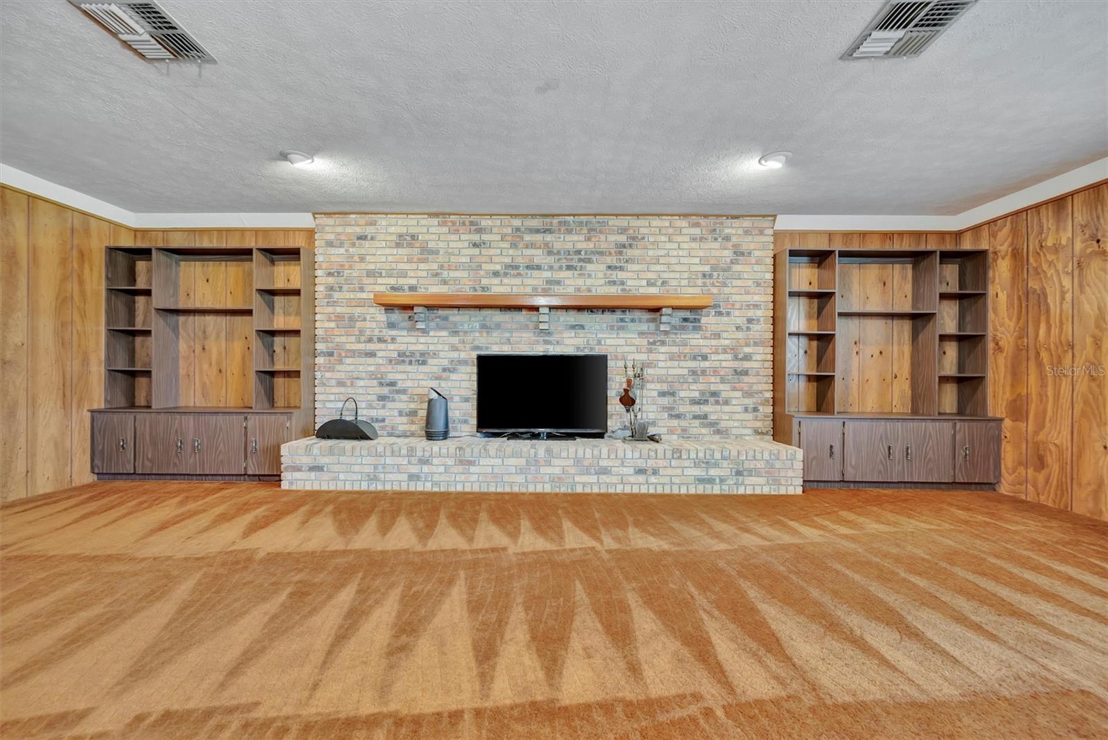 Wood shelving adds both storage and style to the space.