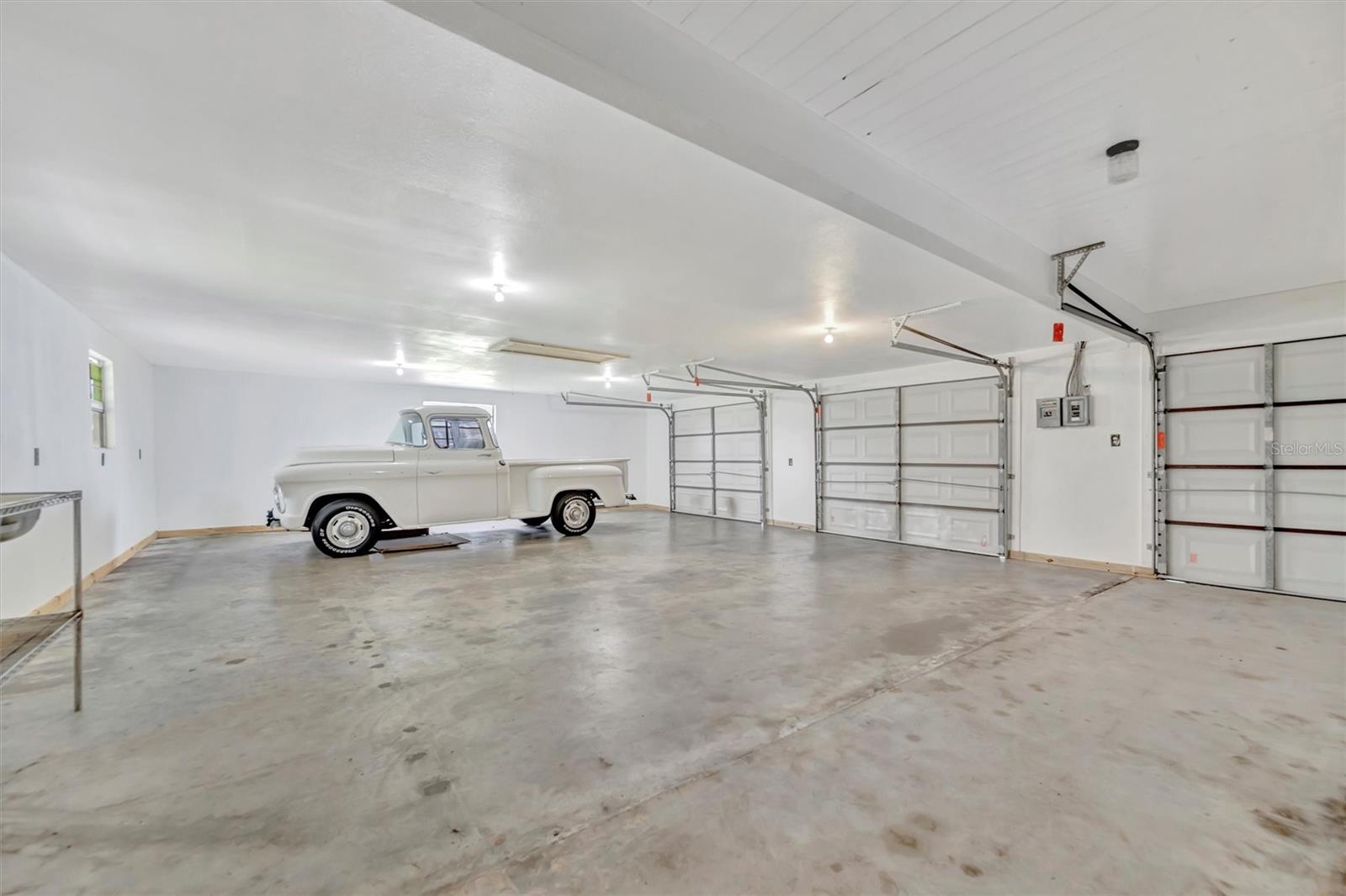 Spacious side garage with potential for conversion to a guest suite or ADU