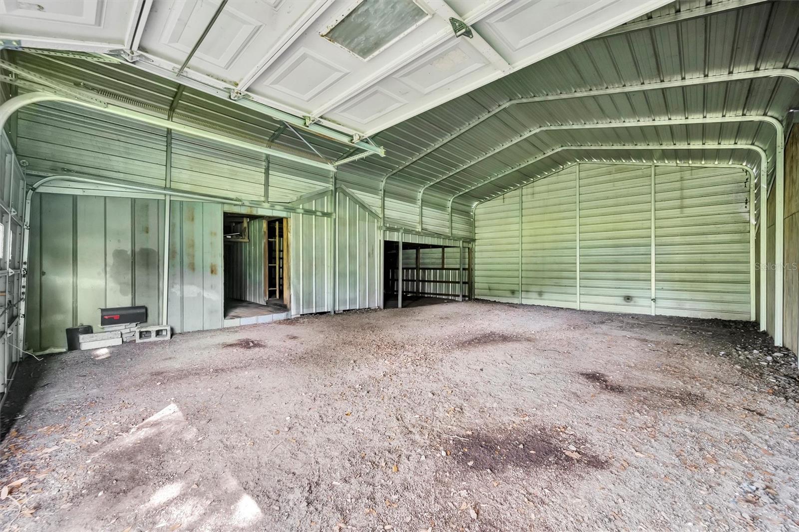 Dedicated workshop area connected to a garage that can hold up to 4 cars—perfect for tools, projects, or future conversion.
