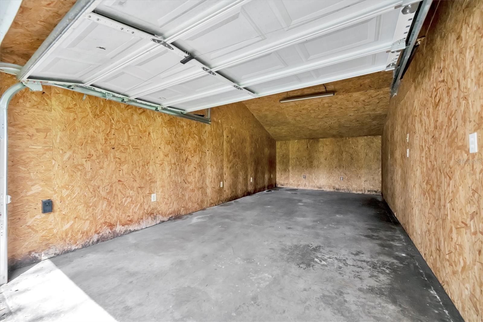 Back of property features six detached garages