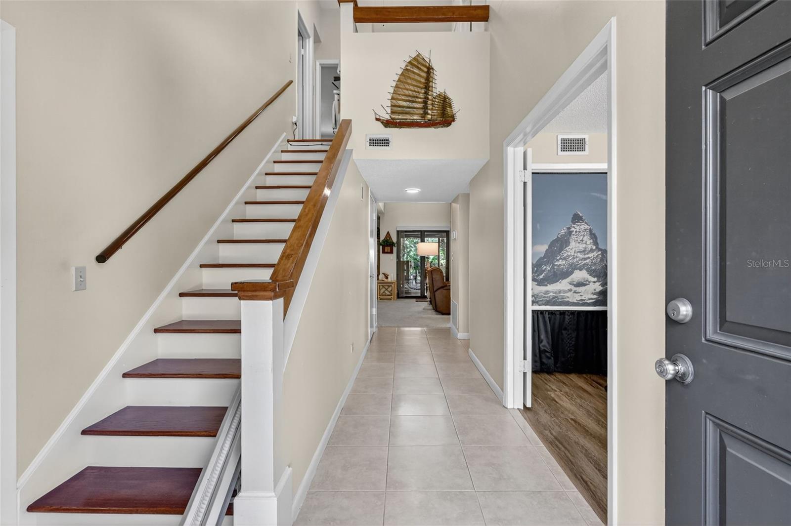 The stiarcase leading the 2nd level has wood flooring