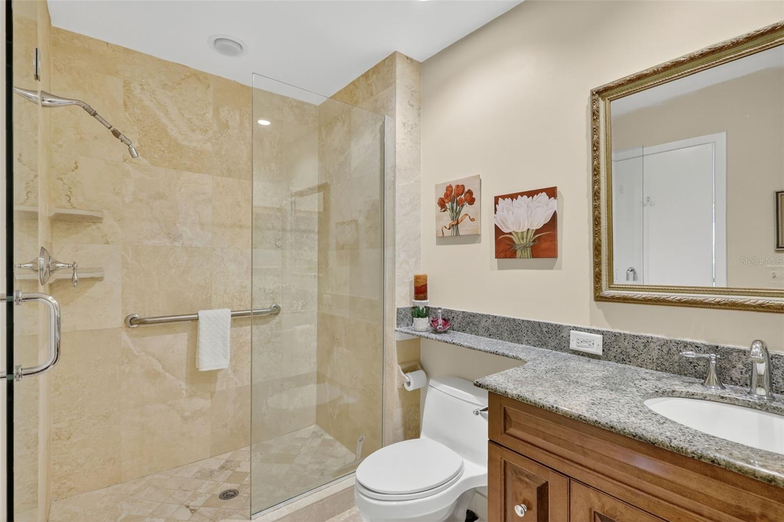 The primary En-Suite has a single vanity and walk in shower