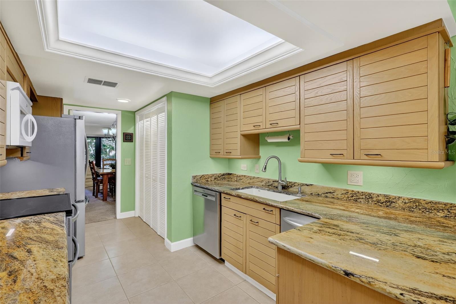 The kitchen has a pantry and washer/dryer closet with stackable appliance.
