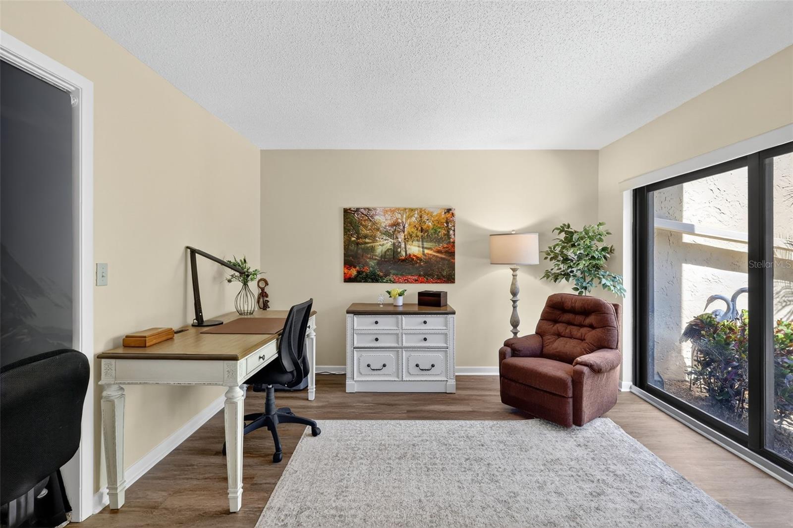 To the right of the entrance is a 2rd/bedroom office area also with a slider leading the the courtyard.