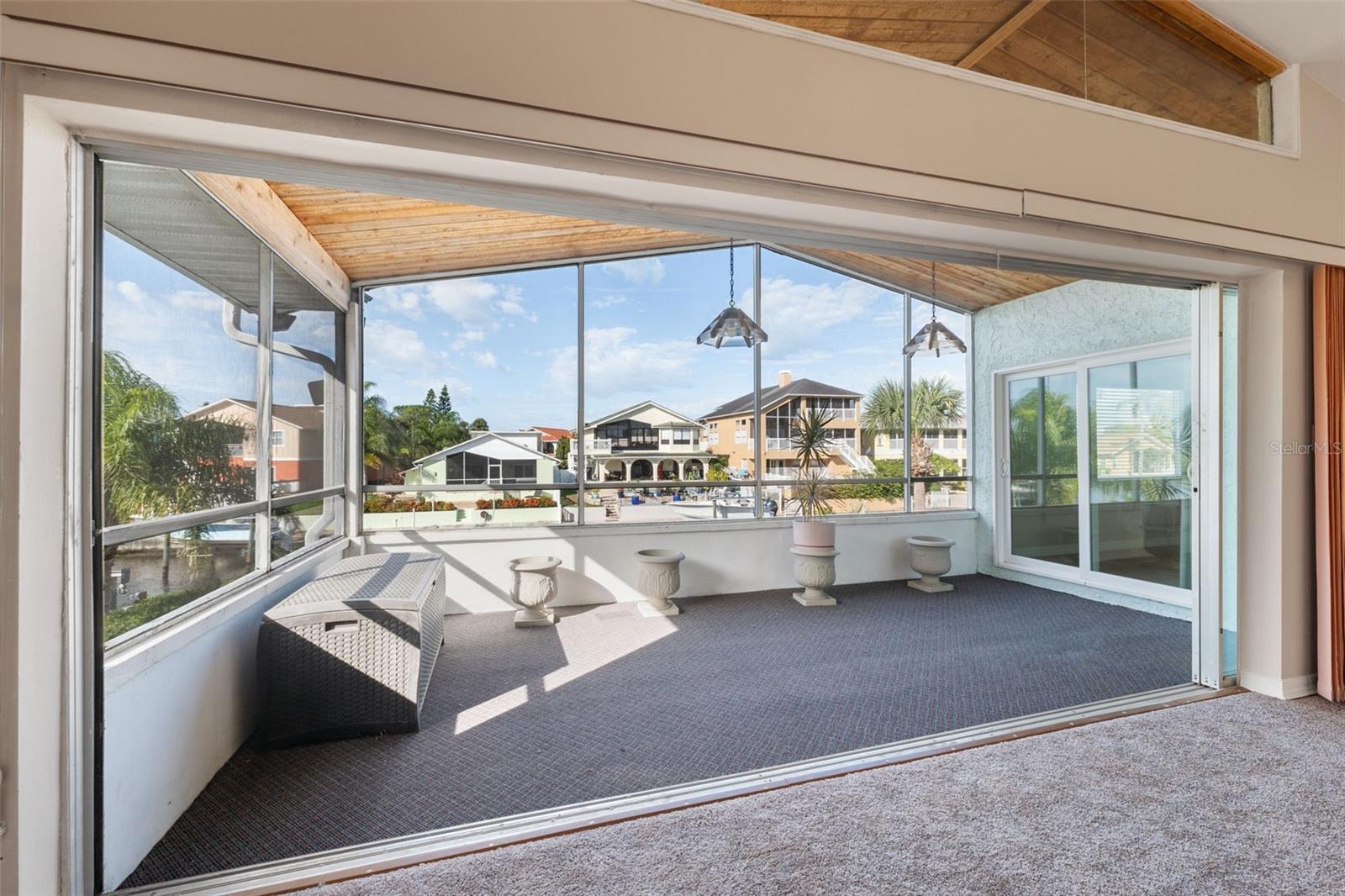 Upper covered and screened sun deck