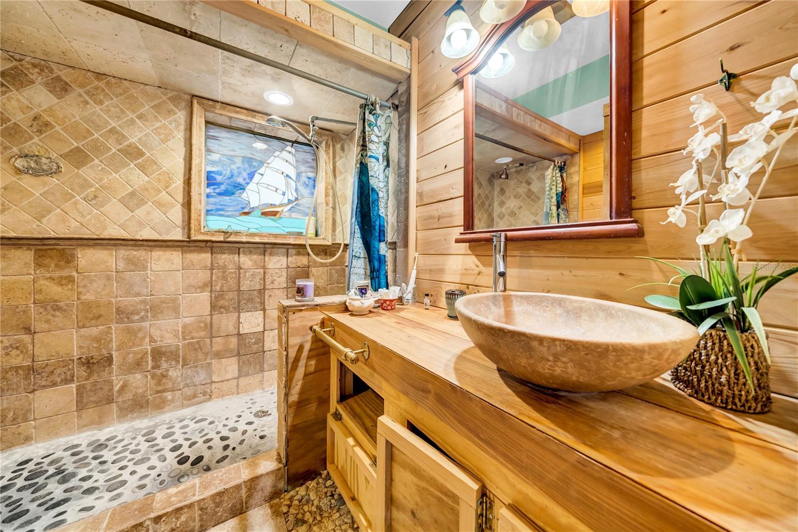 Bathroom inside hidden bookshelf wall