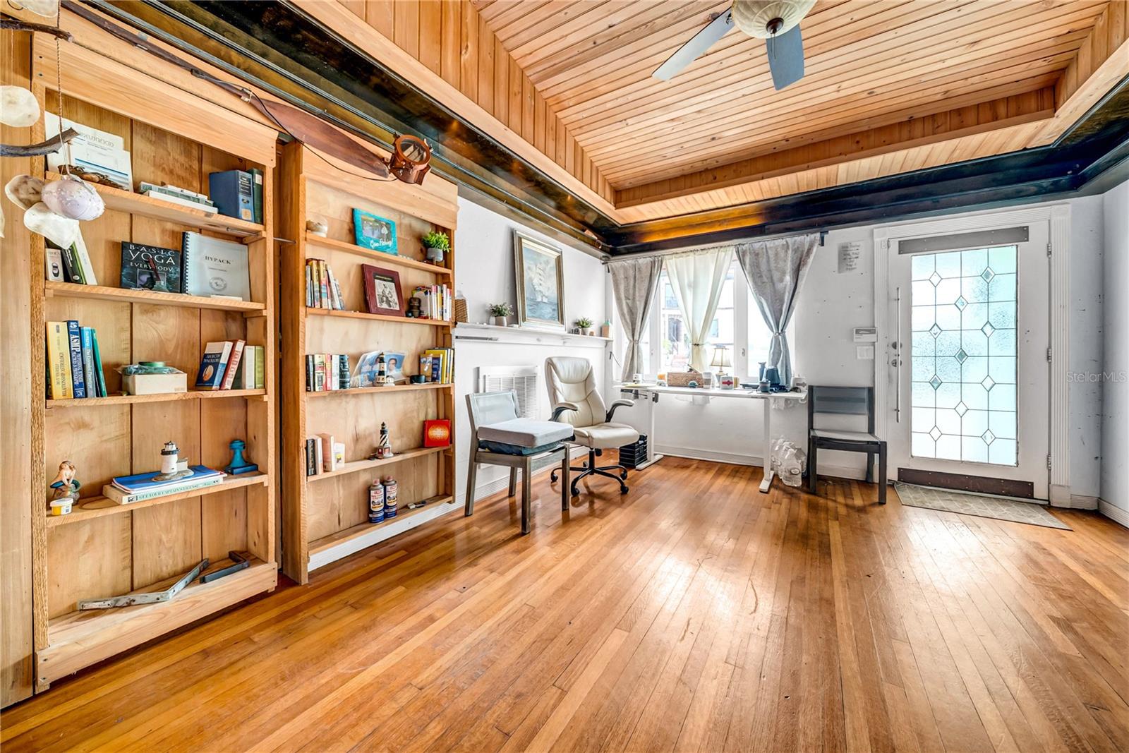 Living room and hidden bookshelf wall