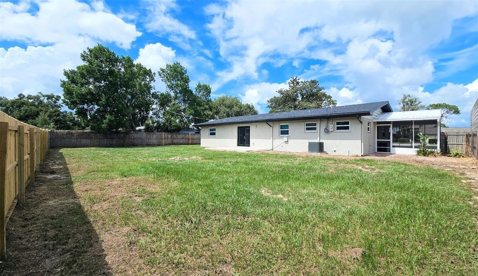 LARGE FENCED IN BACKYARD