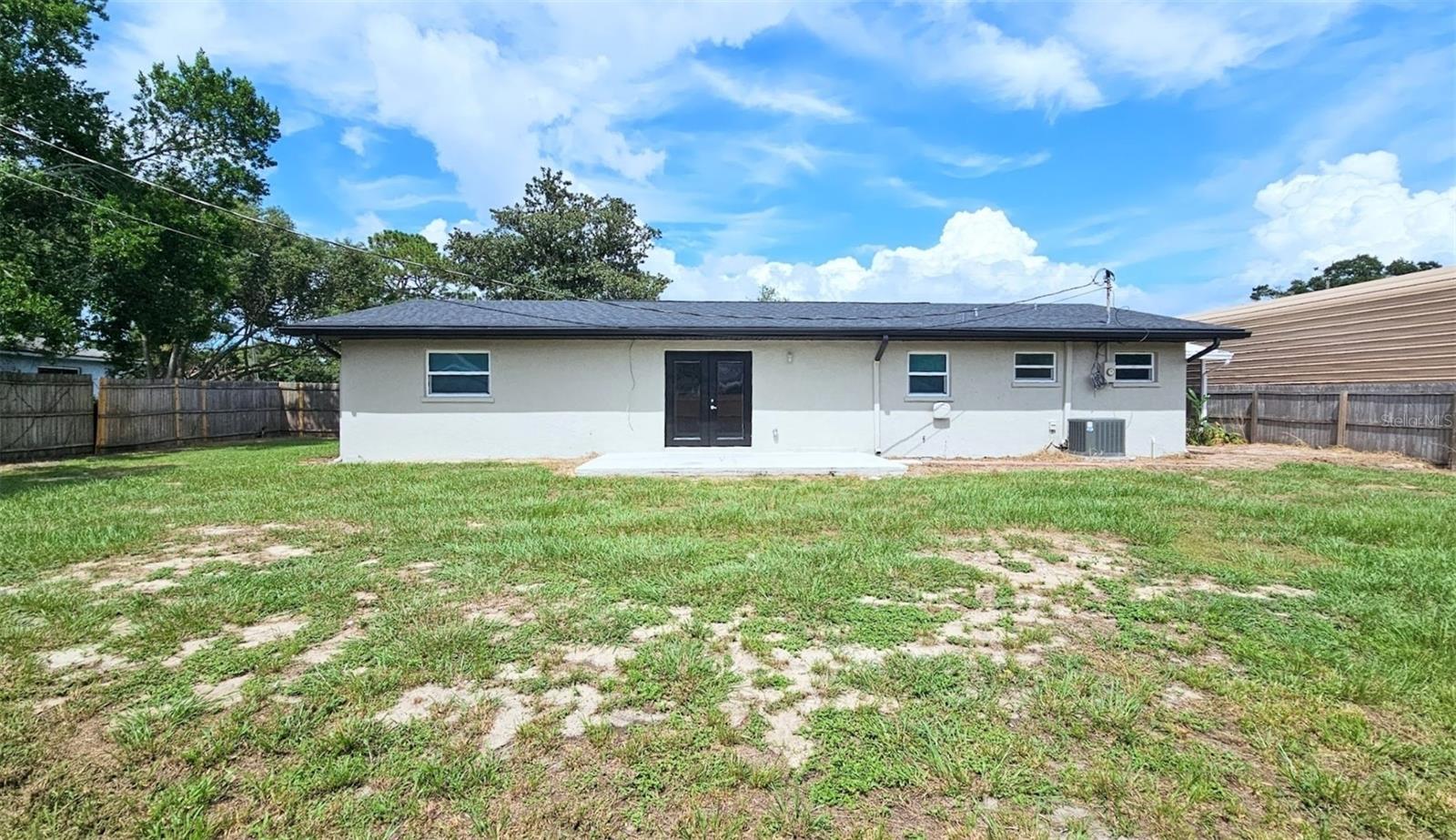 LARGE FENCED IN BACKYARD