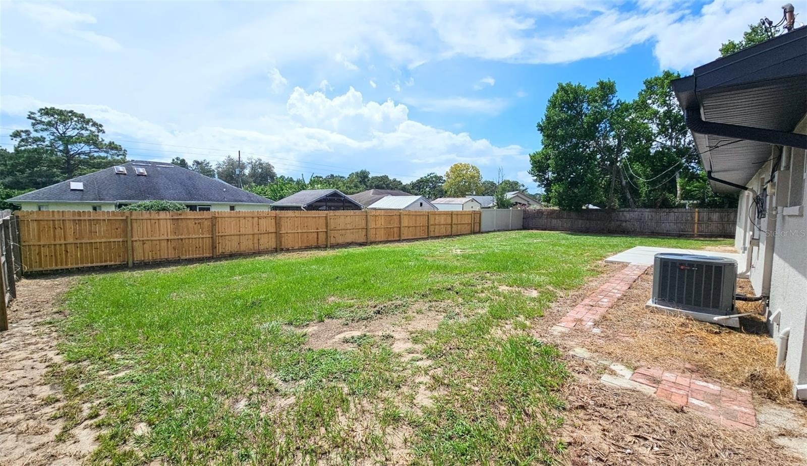 LARGE FENCED IN BACKYARD