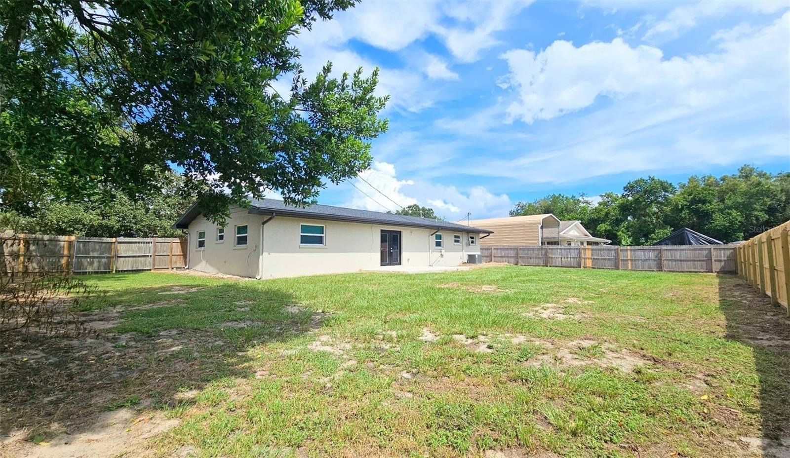 LARGE FENCED IN BACKYARD WITH DOUBLE GATES