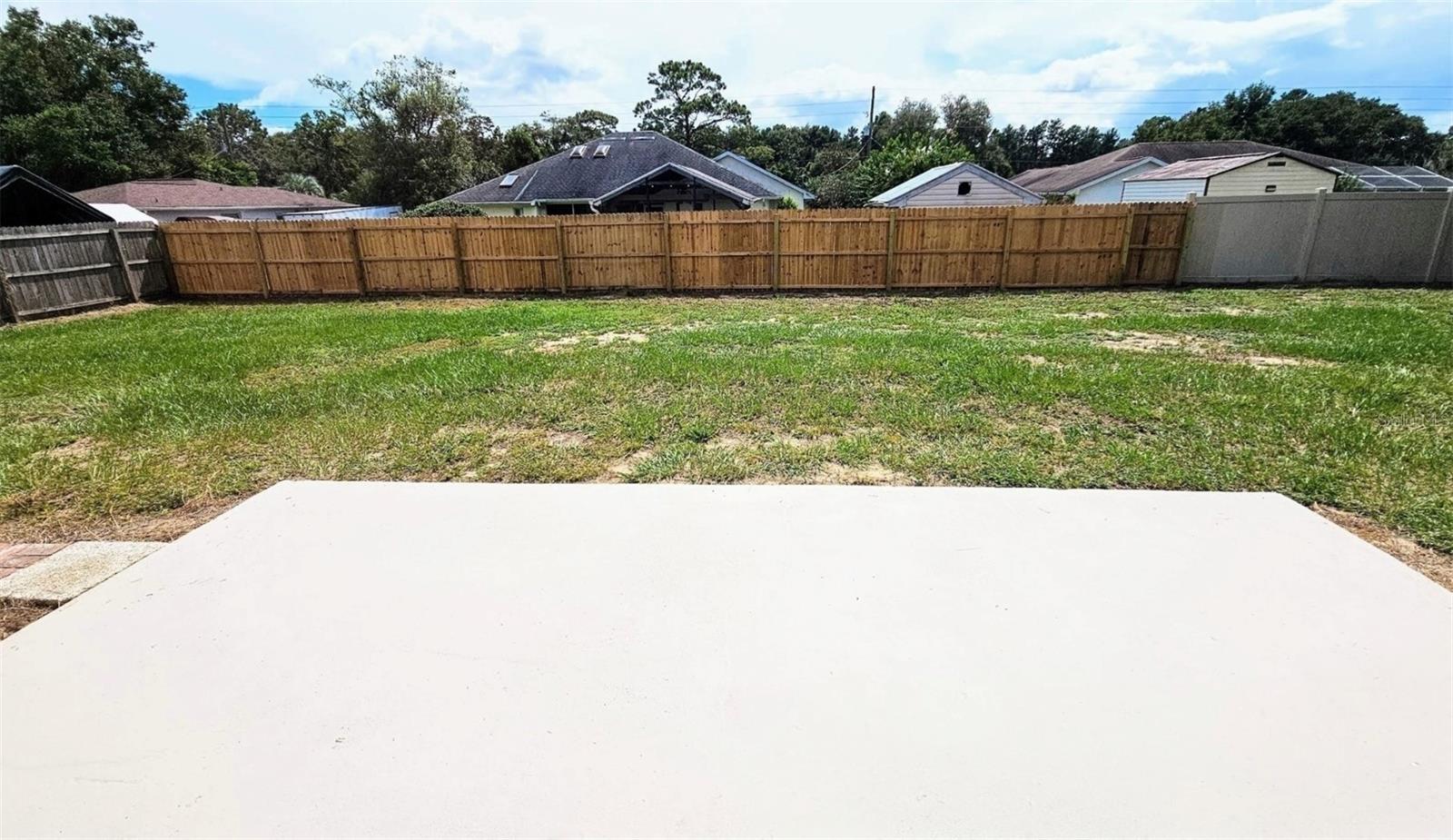 LARGE FENCED IN BACKYARD