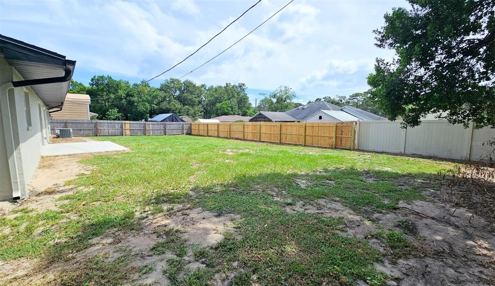 LARGE FENCED IN BACKYARD