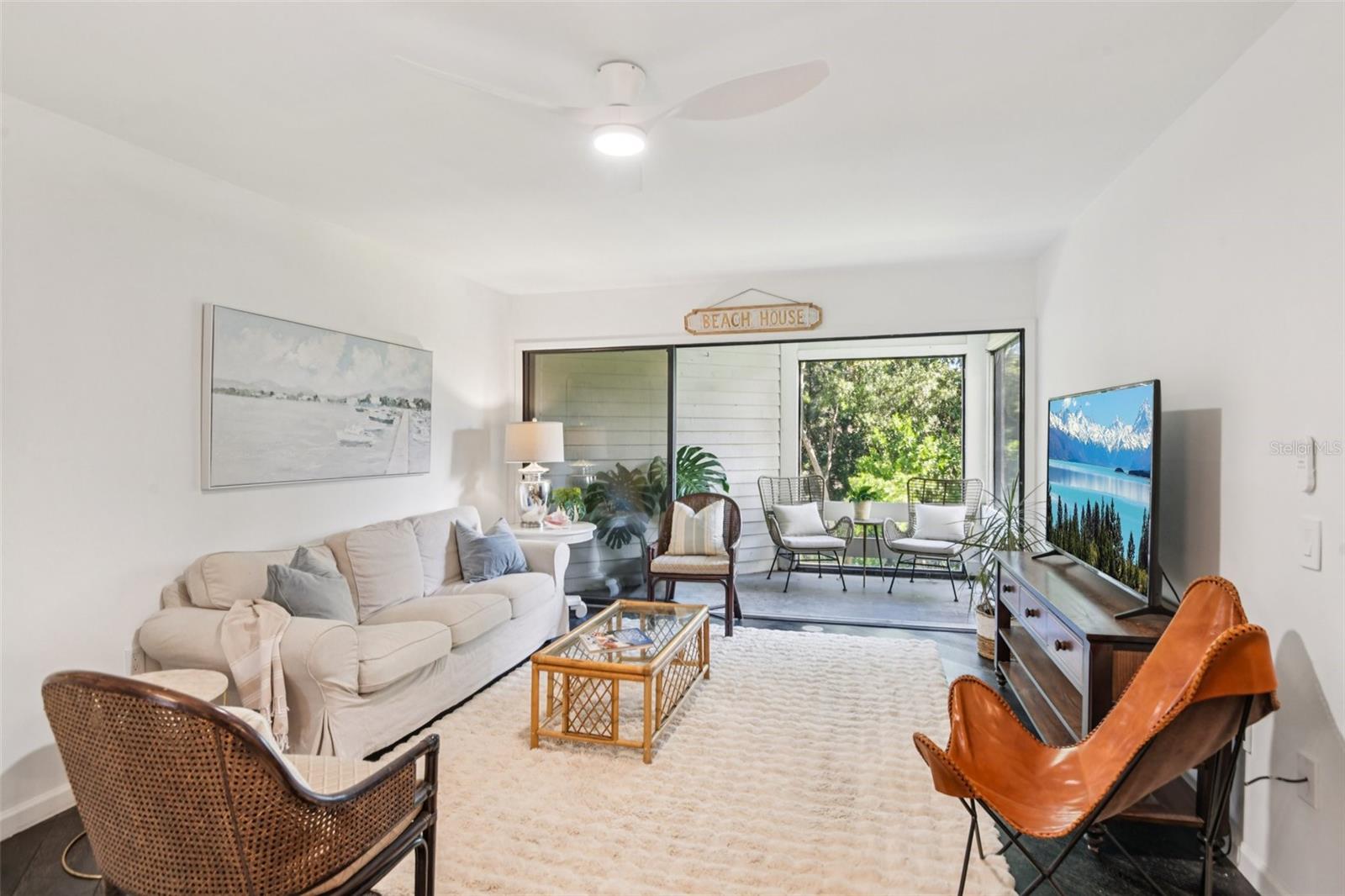 New fans and comfy outdoor furniture with a view of the wooded private area.
