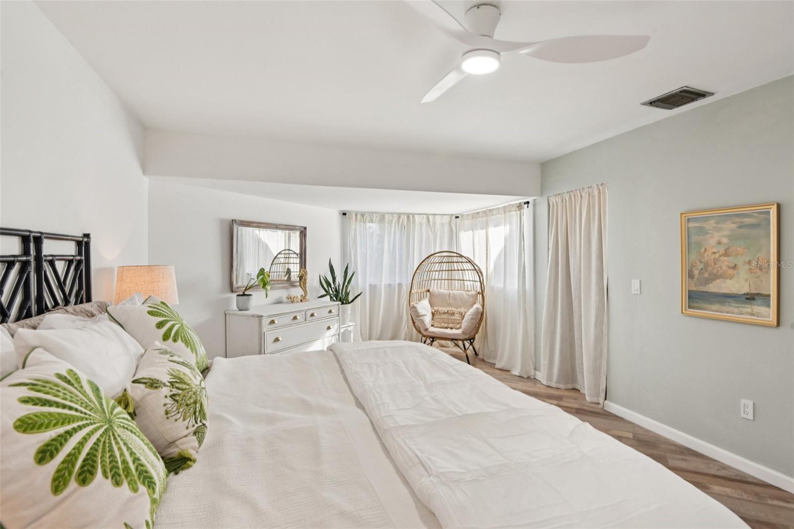 Large primary bedroom with walk in closet.
