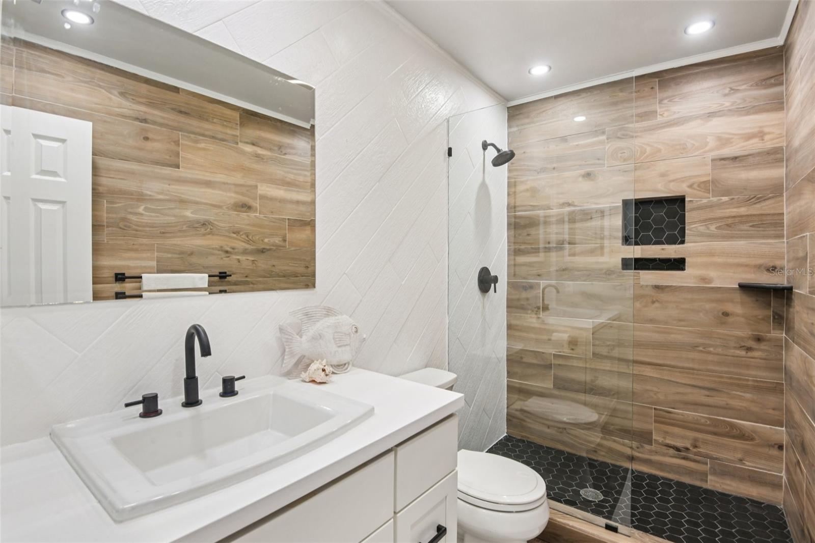 Updated bathroom on the 3rd floor by the 2 bedrooms.